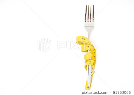 fork with a measuring tape diet or healthy eating 61563066