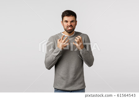 Guy hate everyone look with rage, hateful and furious expression, want choke someone, clench fists threatening, losing patience, look tensed and aggressive, grimacing annoyed, white background Guy hate everyone look with rage, hateful and furious expression, want choke someone, clench fists threatening, losing patience, look tensed and aggressive, grimacing annoyed, white background 61564543