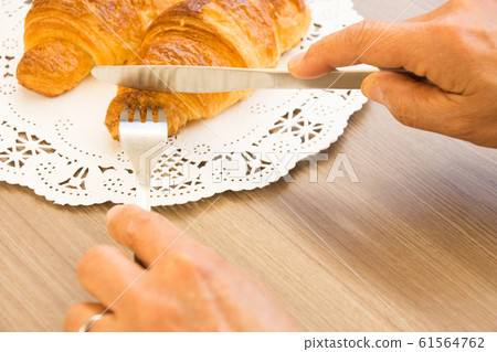 Put knife in bread Put knife in bread 61564762