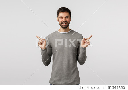 Time make your choice. Cheerful happy, smiling bearded male employee, give advice what buy, shopping sites, pointing sideways, showing left and right promo, suggest choices, white background Time make your choice. Cheerful happy, smiling bearded male employee, give advice what buy, shopping sites, pointing sideways, showing left and right promo, suggest choices, white background 61564860