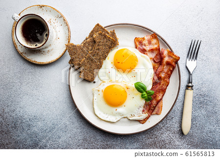 Fried eggs and bacon Fried eggs and bacon 61565813