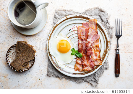 Fried eggs and bacon Fried eggs and bacon 61565814