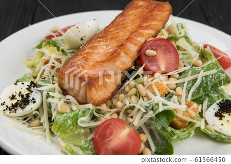 Grilled salmon caesar salad Grilled salmon caesar salad 61566450