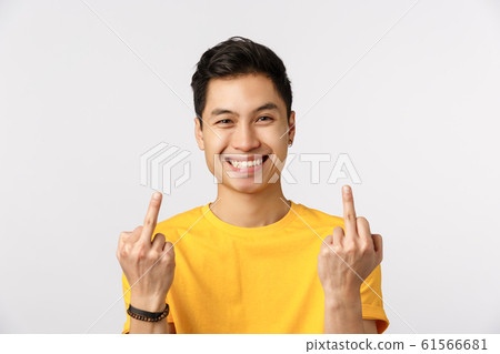 Go fuck yourself. Unbothered and careless young millennial chinese man showing middle fingers and smiling, dont care at all, acting provocative and rebellious, standing white background Go fuck yourself. Unbothered and careless young millennial chinese man showing middle fingers and smiling, dont care at all, acting provocative and rebellious, standing white background 61566681
