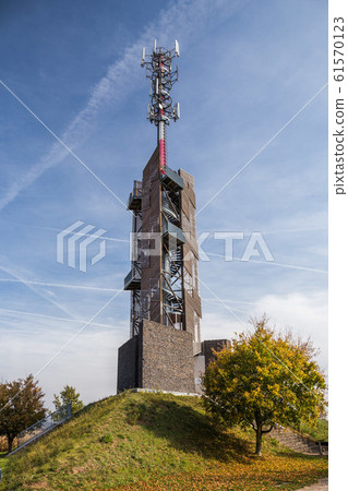 Romanka Lookout Tower is located near village Hruby Jesenik in the district Nymburk in the Central Region. Czech republic. Is is also antenna transmitter. Nice autumn colorful scene with blue sky. 61570123