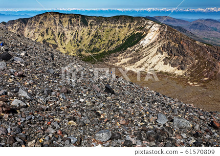 The outer ring mountain and the northern Alps with residual snow seen from the climb of Mt.Asama The outer ring mountain and the northern Alps with residual snow seen from the climb of Mt.Asama 61570809