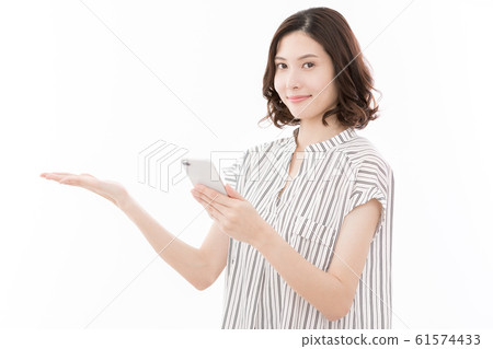 Young woman smartphone 5G pointing hand palm 61574433