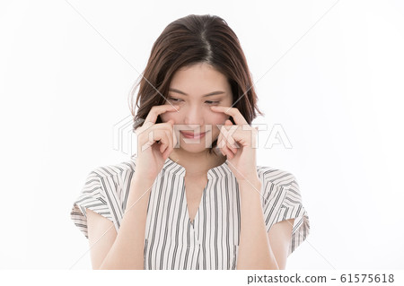 Young woman crying tears 61575618