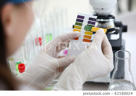 Scientist doing comparison of two test Scientist doing comparison of two test 61580024