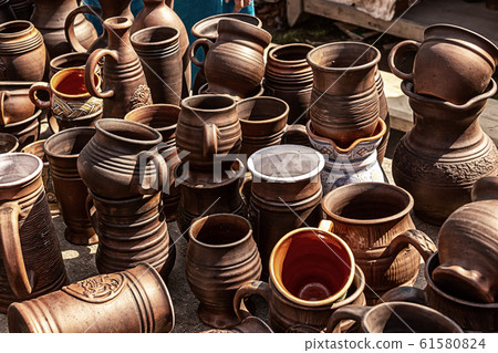 brown mug made from natural materials of clay for 61580824