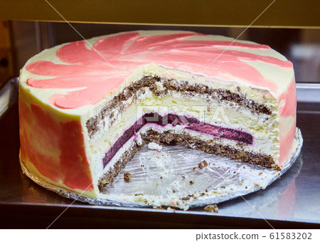 Delicious cake with cheese filling with poppy seeds and nuts. Delicious cake with cheese filling with poppy seeds and nuts. 61583202