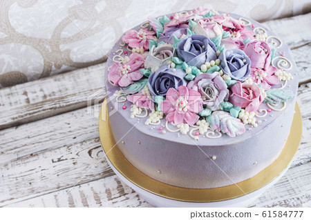 Birthday cake with flowers rose on white background 61584777