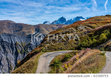 View of the mountains around Alpe d'Huez in the french Alps, France View of the mountains around Alpe d'Huez in the french Alps, France 61589753