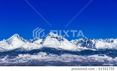 View of the landscape with snowy mountains. View of the landscape with snowy mountains. 61591739