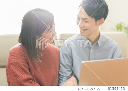 Young couple (computer, living room, home, internet Young couple (computer, living room, home, internet 61593433