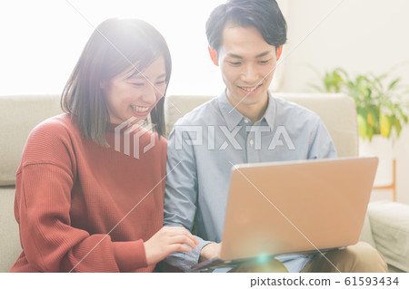 Young couple (computer, living room, home, internet Young couple (computer, living room, home, internet 61593434