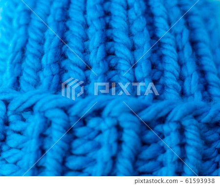 Knitted texture. A sample of knitting from wool. 61593938