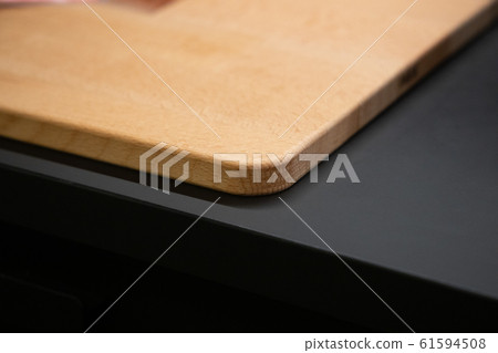 Cutting Board on the kitchen table close-up Cutting Board on the kitchen table close-up 61594508