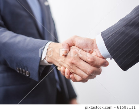 Male businessman shaking hands Male businessman shaking hands 61595111