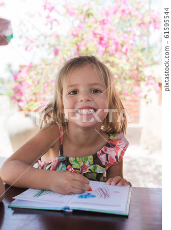 Adorable little girl drawing artwork top view on Adorable little girl drawing artwork top view on 61595544