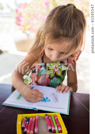 Adorable little girl drawing artwork top view on Adorable little girl drawing artwork top view on 61595547