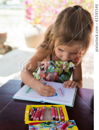 Adorable little girl drawing artwork top view on Adorable little girl drawing artwork top view on 61595548
