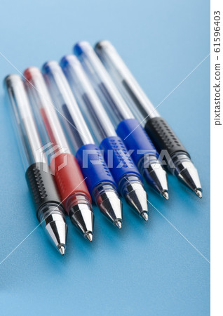 pen on blue background 61596403