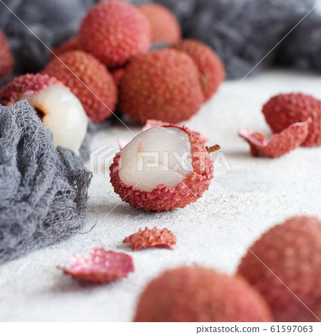 Fresh litchi fruits on a white table 61597063