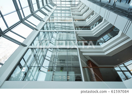 Part of exterior of contemporary high office building, outdoor view Part of exterior of contemporary high office building, outdoor view 61597084