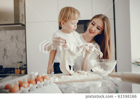 Family cook the dough for cookies 61598166