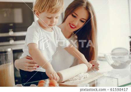 Family cook the dough for cookies Family cook the dough for cookies 61598417