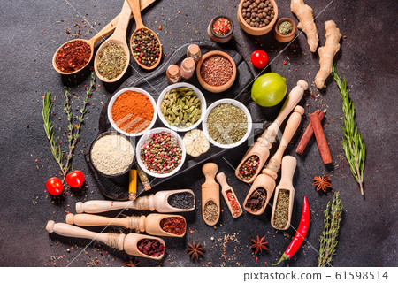 Spices and herbs over black stone background 61598514