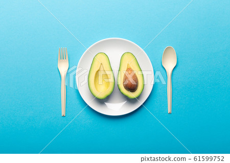 Eating avocado and getting bioplastic disposable tableware 61599752
