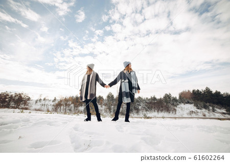 Two cute girls in a winter park 61602264