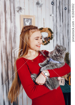 Little girl with cat Little girl with cat 61604002