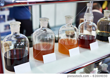 Chemical fluids on shelf in industrial laboratory 61604030