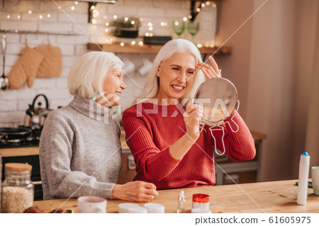 Two good-looking elderly women looking happy and joyful 61605975