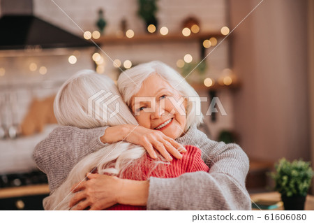 Two mature grey-haired positive ladies feeling happy Two mature grey-haired positive ladies feeling happy 61606080