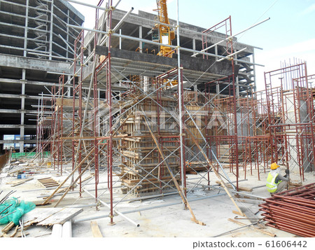 Scaffolding used as the temporary structure to support platform, form work and structure at the construction site. Also used it as a walking platform for workers. Scaffolding used as the temporary structure to support platform, form work and structure at the construction site. Also used it as a walking platform for workers. 61606442