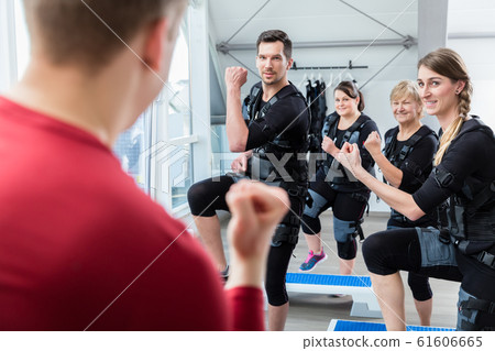 Group of people having ems training in the electro gym 61606665