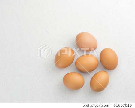 Six eggs placed on the floor isolate on white background. Top view. Six eggs placed on the floor isolate on white background. Top view. 61607010
