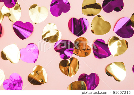 Colorful heart confetti on a background. 61607215