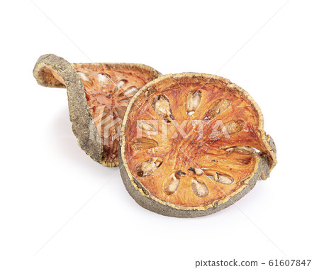 Dry Bael fruit - Slices of dry Bael fruit isolated on white  background 61607847