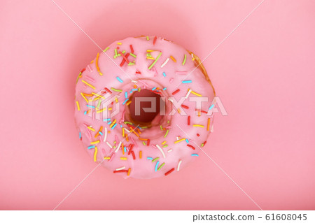 Pink donut on a pink background, minimalism concept, color game.background, copy space 61608045