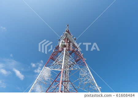 Communication tower and blue sky view.  61608484