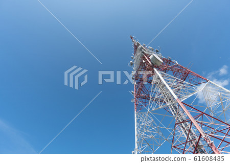 Communication tower and blue sky view.  61608485