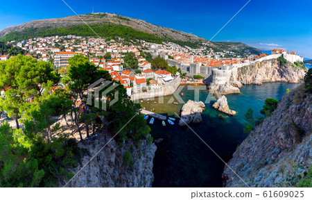 Dubrovnik. Old city walls and towers at sunset. Dubrovnik. Old city walls and towers at sunset. 61609025
