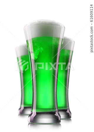 Green beer in glasses isolated on a white background. 61609114
