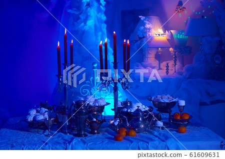 Table setting with candles, marshmallows and tangerines. Holidays, catering and hospitality concept. 61609631