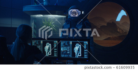 Astronaut testing spacesuit mobility 61609935